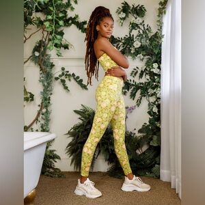 Popflex plié sports bralette and corset leggings, both in green rose size M